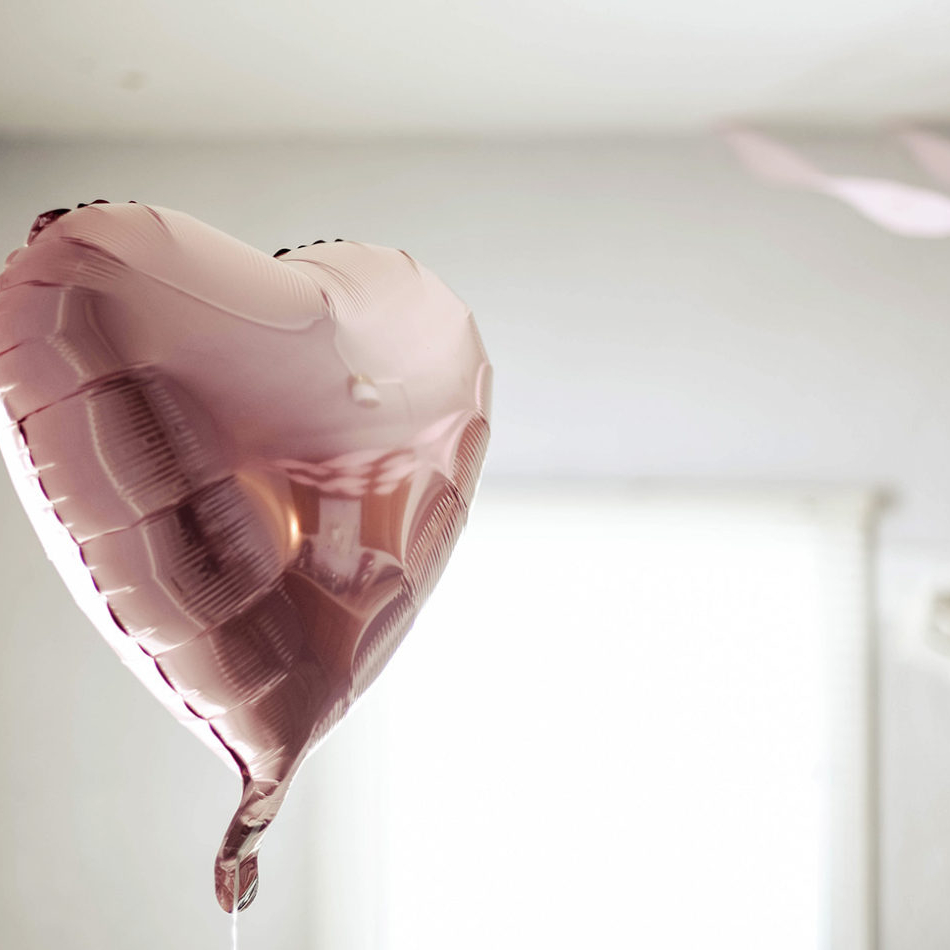 A pink balloon shaped like a heart
