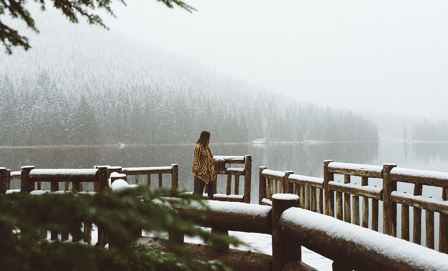 A woman in a snowy wooden platform